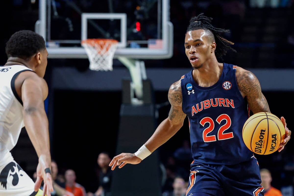 Auburn guard Allen Flanigan dribbles the ball during the first half of the team's first-round c ...