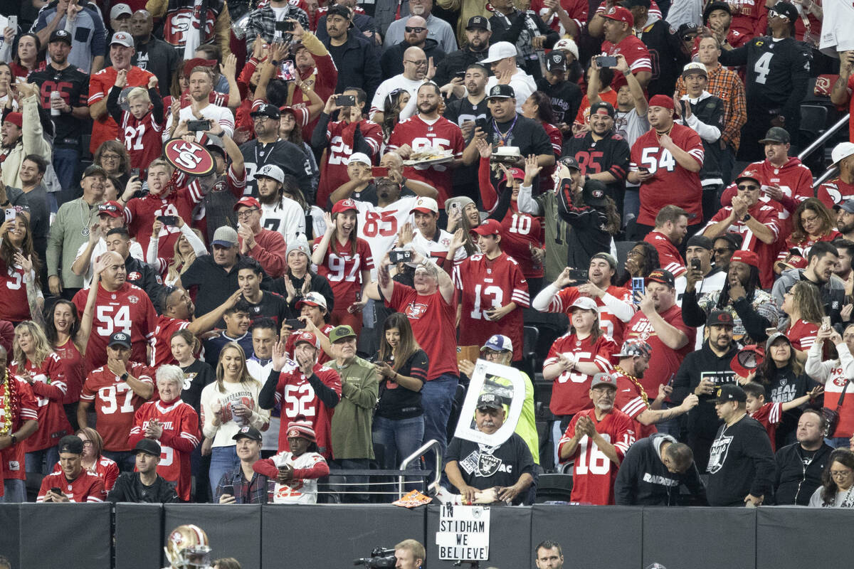 A sea of San Francisco 49ers fans take over a section in Allegiant Stadium for an NFL game agai ...