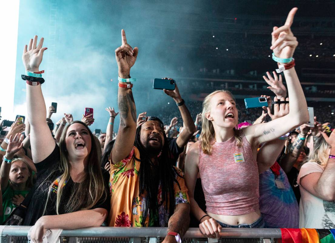 Fans cheer as Dan Reynolds, of Imagine Dragons, performs at Allegiant Stadium, on Saturday, Sep ...