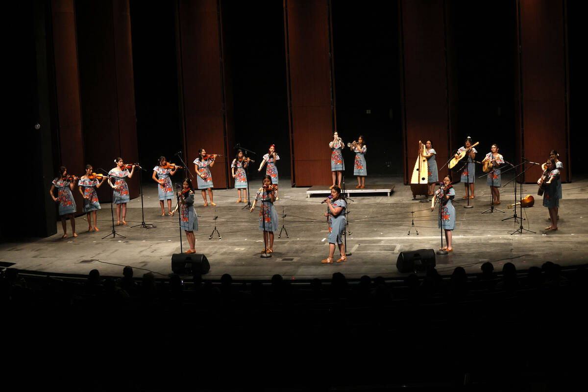 Members of the Las Vegas Academy of the Arts Mariachi Femenil Internacional group perform durin ...