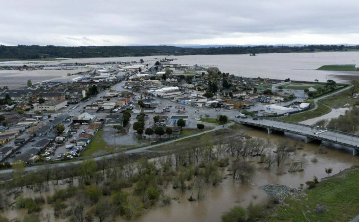 This photo shows a flooded Pajaro River in Pajaro, Calif. on Tuesday, March 14, 2023. (Californ ...