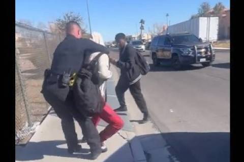A screenshot of a video showing an incident between a CCSD police officer and someone who appea ...