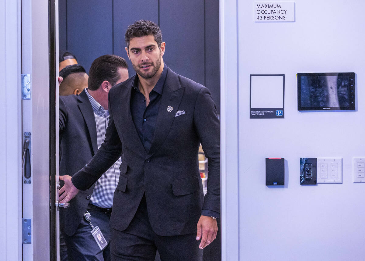 Jimmy Garoppolo enters the room for a press conference at the Raiders Headquarters and Intermou ...