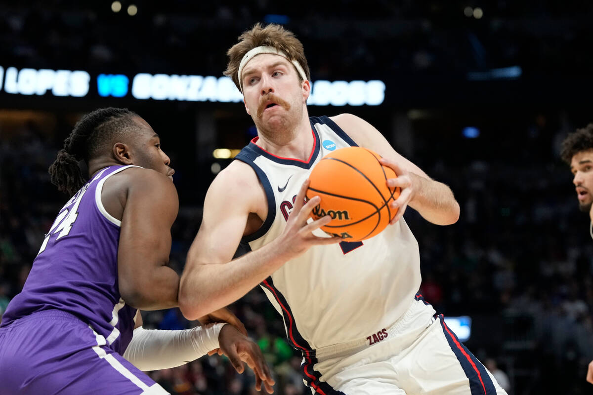 Gonzaga forward Drew Timme, right, drives past Grand Canyon forward Yvan Ouedraogo during the f ...