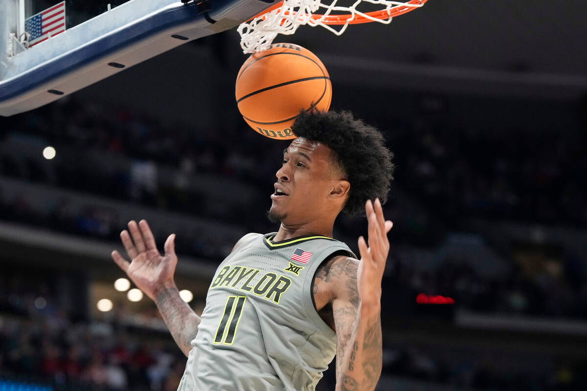 Baylor forward Jalen Bridges dunks in the first half of a first-round college basketball game a ...