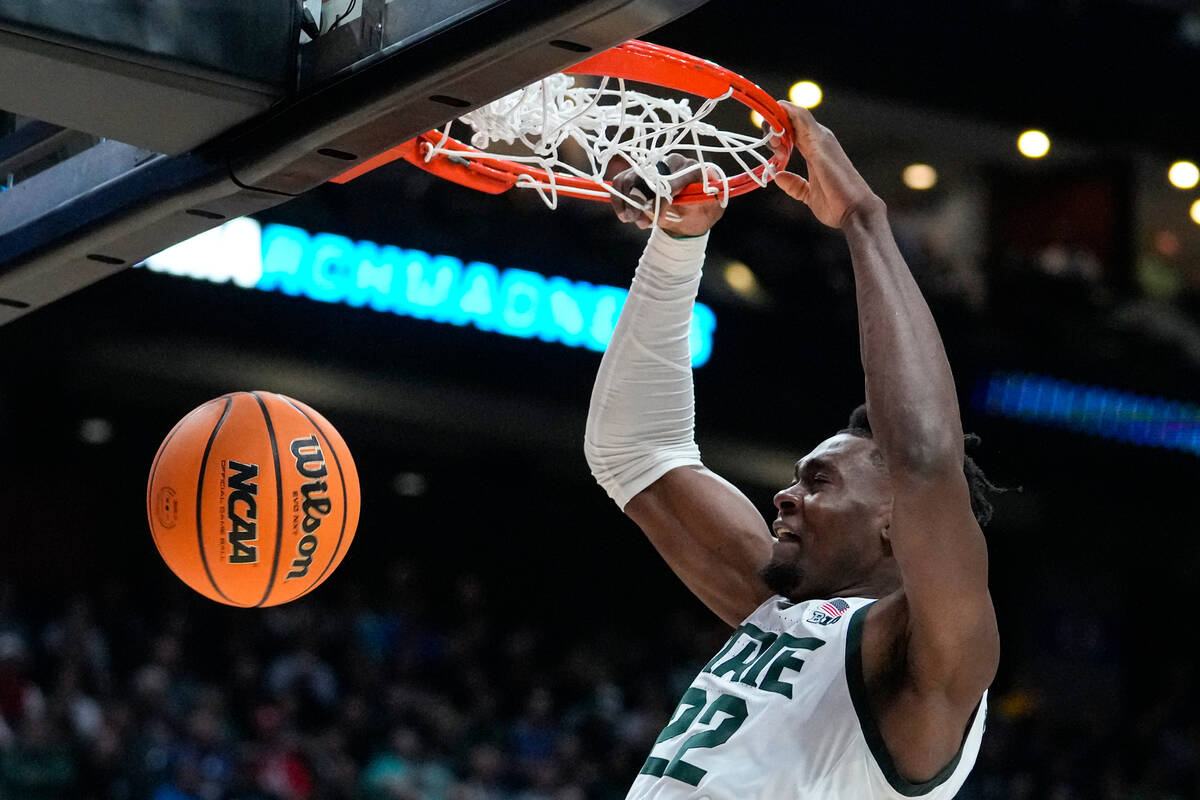 Michigan State center Mady Sissoko (22) gets a dunk against Southern California in the first ha ...