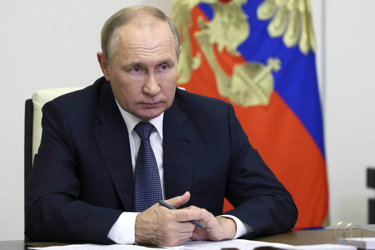 FILE - Russian President Vladimir Putin speaks to Governor of Magadan Region Sergey Nosov via v ...