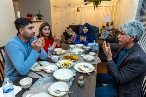 Mohammad "Benny" Shirzad, his wife Shabana, mother Nazanin and father Abdul say prayers followi ...