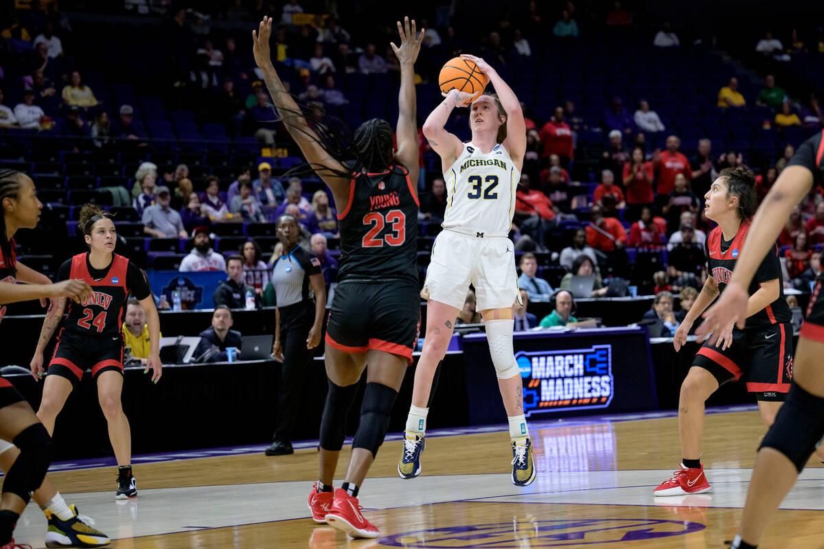 Michigan guard Leigha Brown (32) shoots against UNLV center Desi-Rae Young (23) in the second h ...