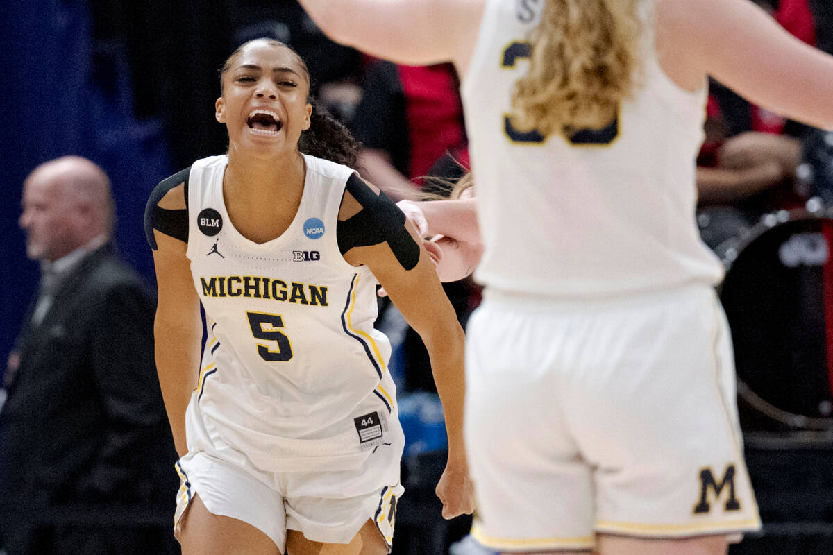 Michigan guard Laila Phelia (5) celebrates scoring against UNLV in the first half of a first-ro ...