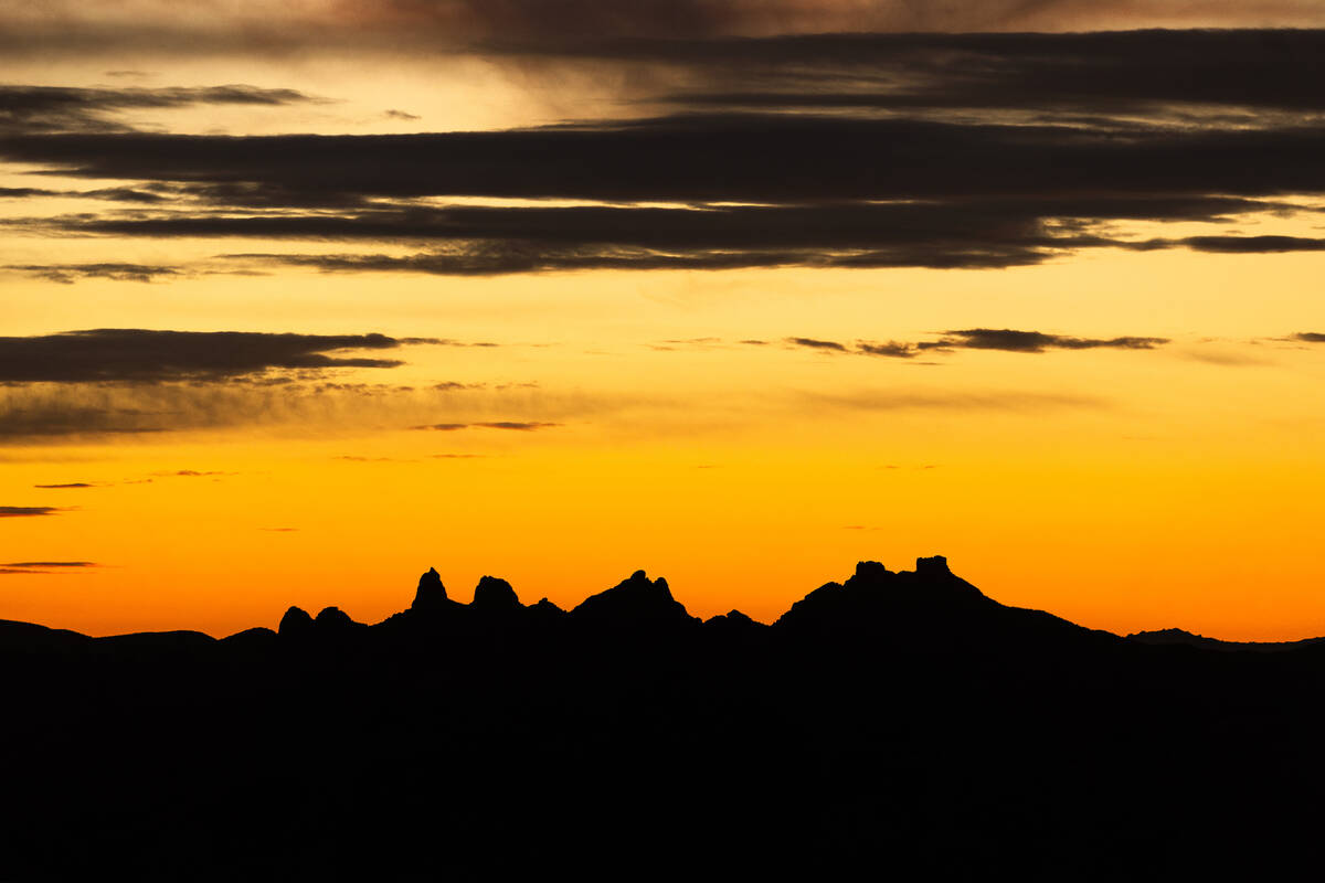 The sun sets beyond the Castle Mountains within the Avi Kwa Ame National Monument on Monday, Fe ...