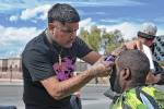 Teenage barbers give back with free haircuts for homeless