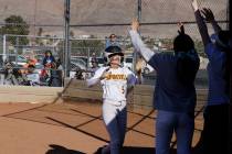 Eldorado teammates greet Erica Madrid (5) after her inside-the-park home run during the second ...