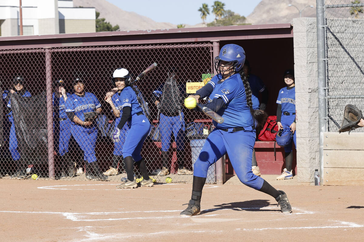 Desert Pines' Alondra Garcia (16) hits the ball during the second inning of a softball game aga ...