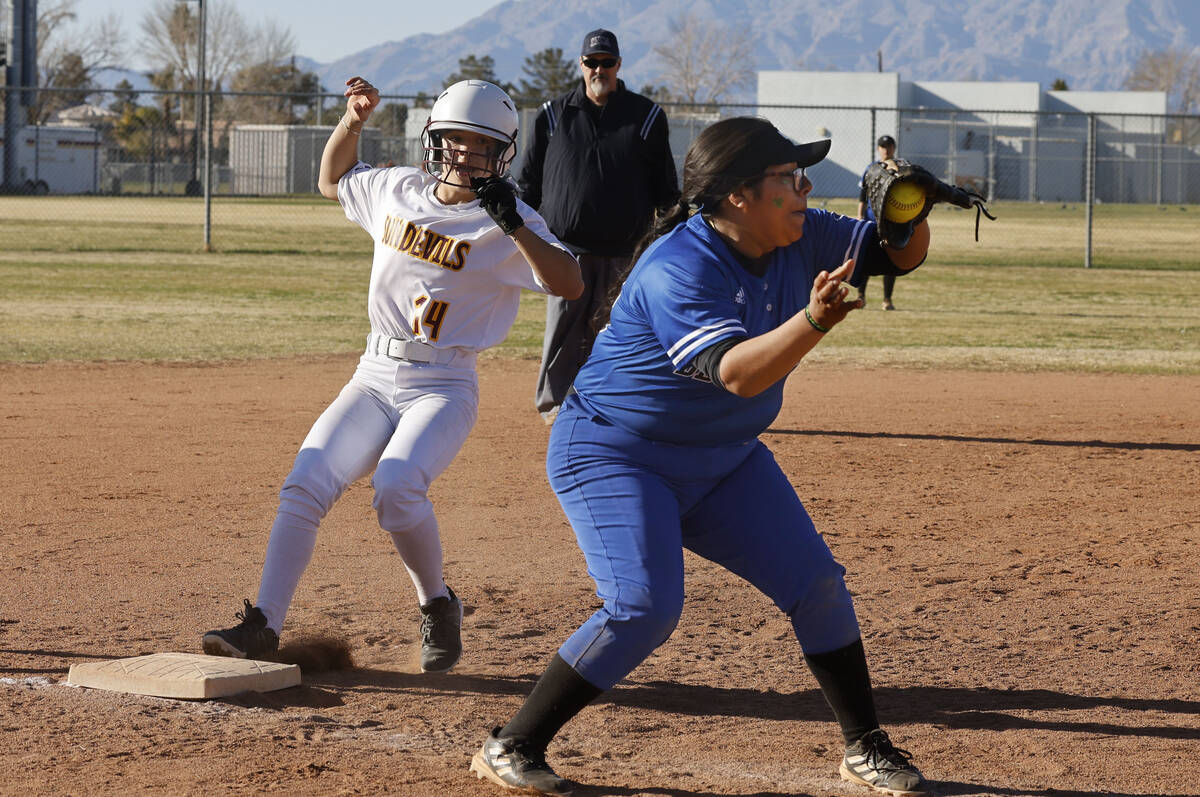 Desert Pines' Jocelyn Galvez Cruz (23) receives a ball as Eldorado's Tatiana Sepulveda is safe ...