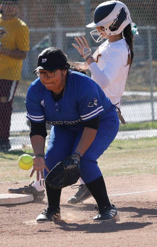 Desert Pines' Jocelyn Galvez Cruz (23) receives a ball as Eldorado's Erica Madrid is safe on he ...