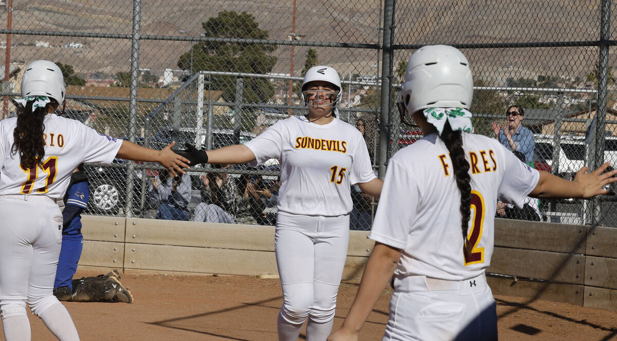 Eldorado's Rachel Figueroa-Corrales (15) is congratulated by her teammates Tania Rubio (11) and ...