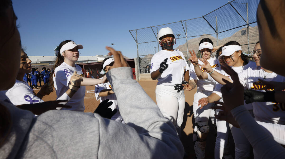 Eldorado players celebrate their 19-4 victory abasing Desert Pines after a softball game at Eld ...