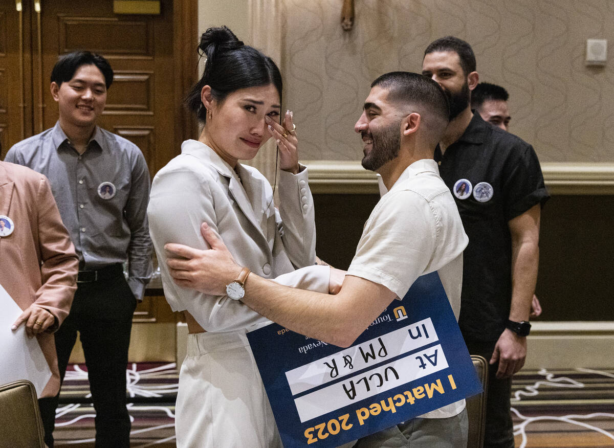 Ellie Ok, left reacts as she is congratulated by her friend Heerod Malekghassemi, of Los Angel ...