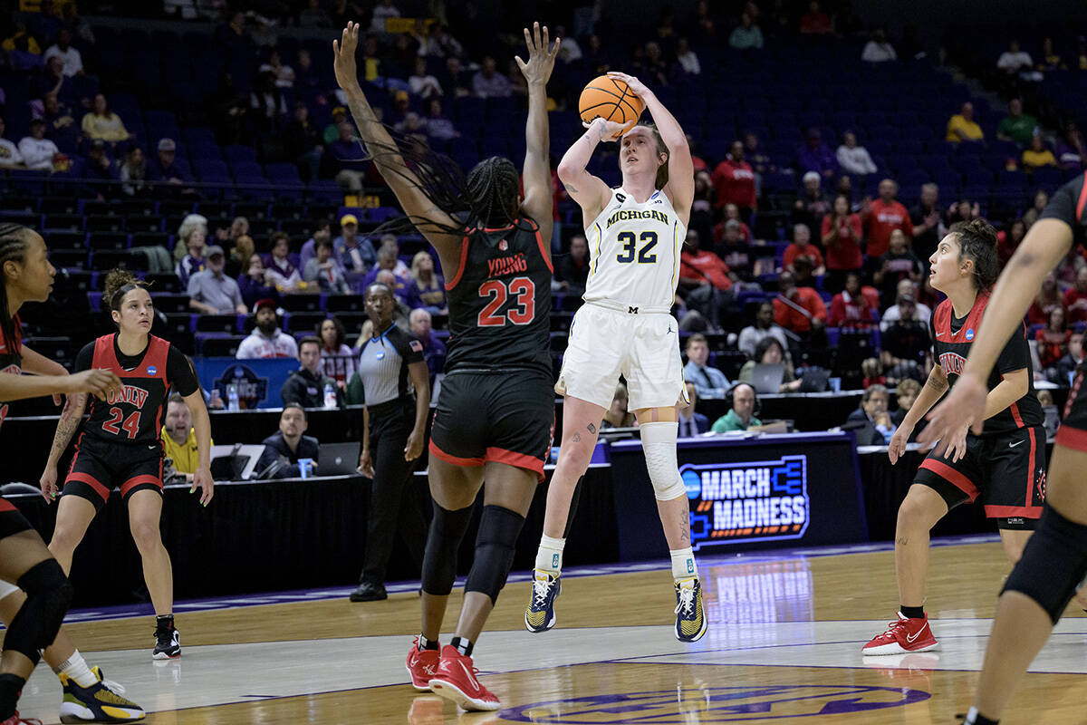 Michigan guard Leigha Brown (32) shoots against UNLV center Desi-Rae Young (23) in the second h ...
