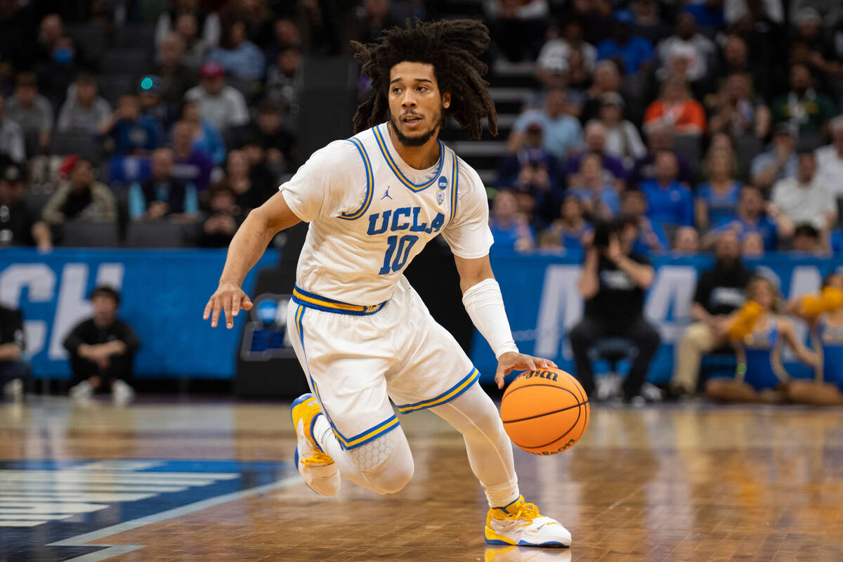 UCLA guard Tyger Campbell (10) breaks for the basket in the first half of a second-round colleg ...