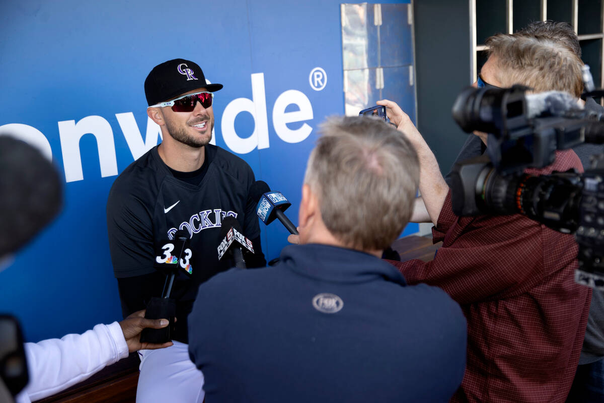 Kris Bryant of the Colorado Rockies speaks to the press before an MLB exhibition game between t ...