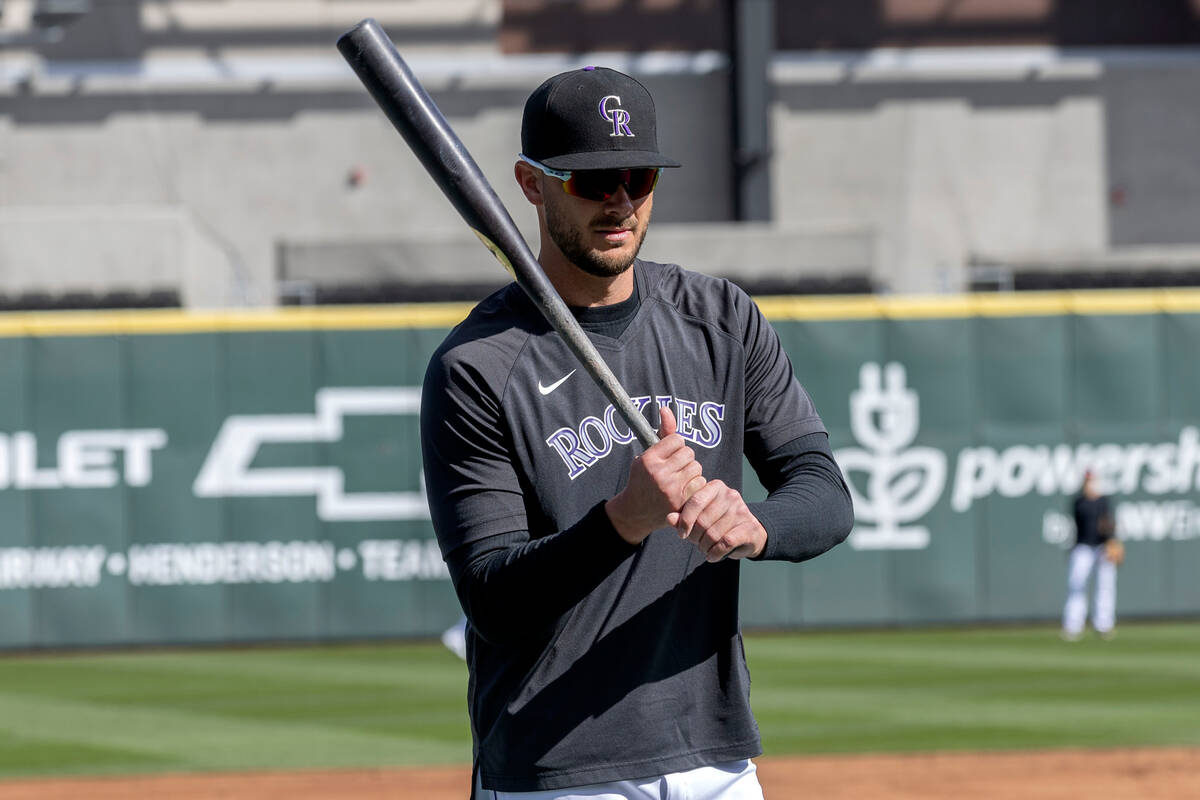 Kris Bryant of the Colorado Rockies grips his bat during practice before an MLB exhibition game ...