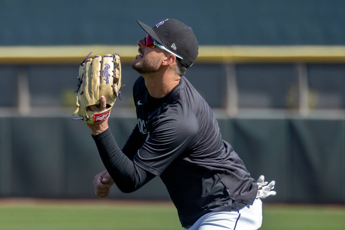 Kris Bryant of the Colorado Rockies anticipates the ball during practice before an MLB exhibiti ...
