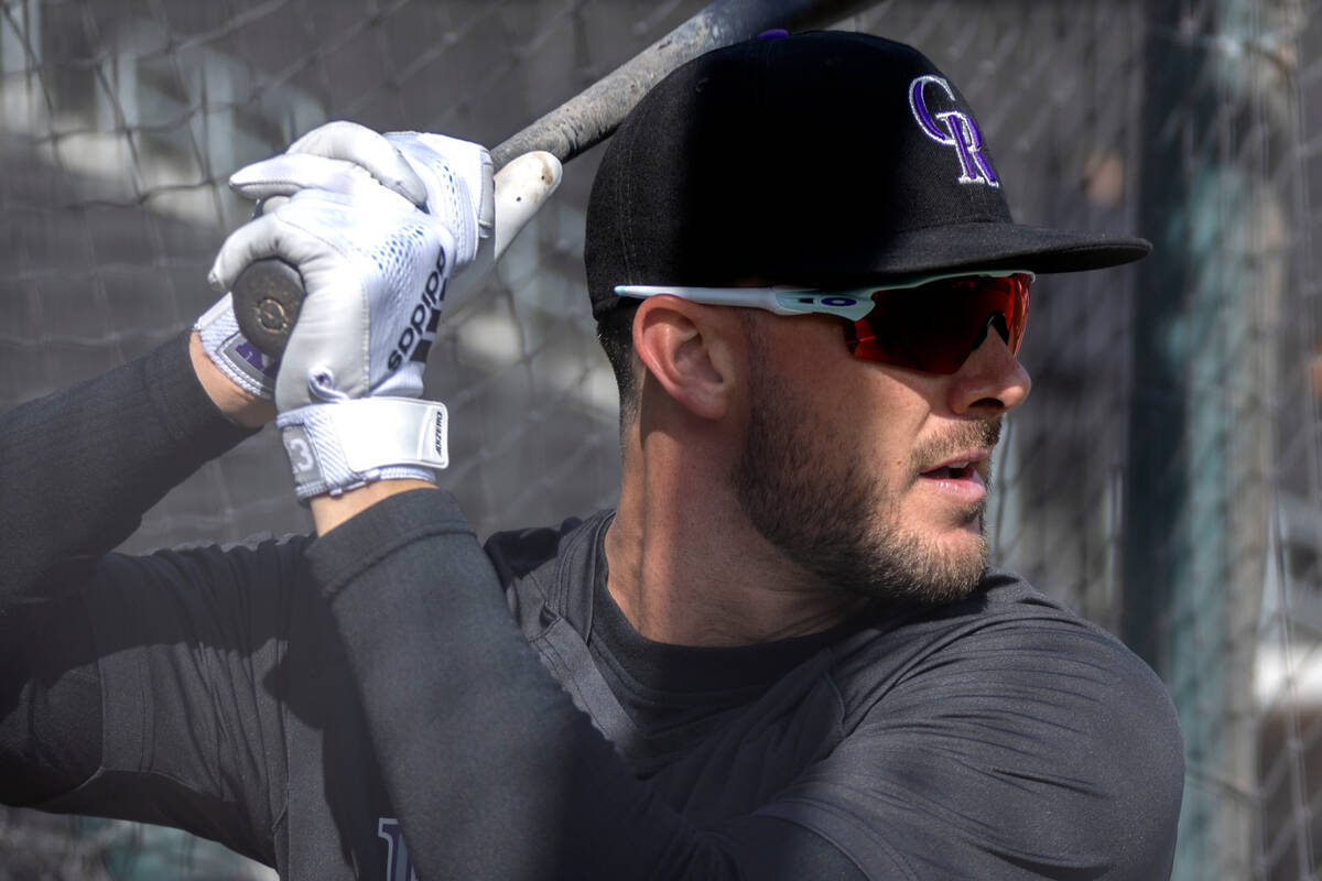 Kris Bryant of the Colorado Rockies bats during practice before an MLB exhibition game between ...