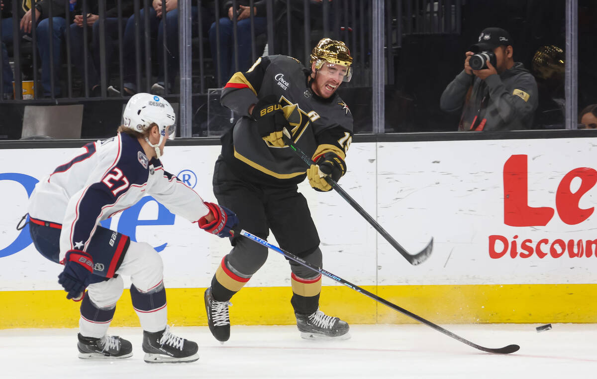 Golden Knights right wing Reilly Smith (19) fires the puck past Columbus Blue Jackets defensema ...