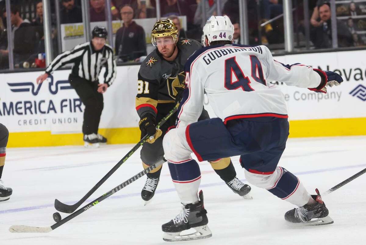 Golden Knights right wing Jonathan Marchessault (81) skates with the puck under pressure from C ...