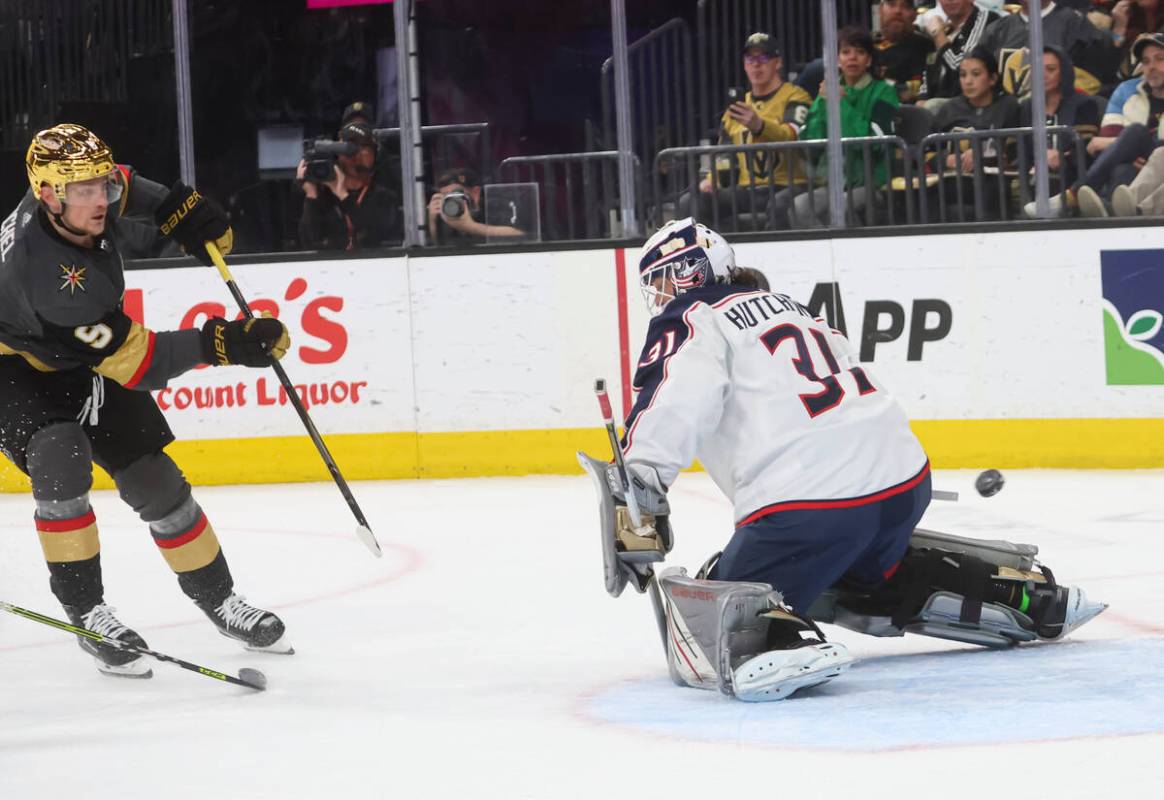 Golden Knights center Jack Eichel (9) shoots the puck past Columbus Blue Jackets goaltender Mic ...