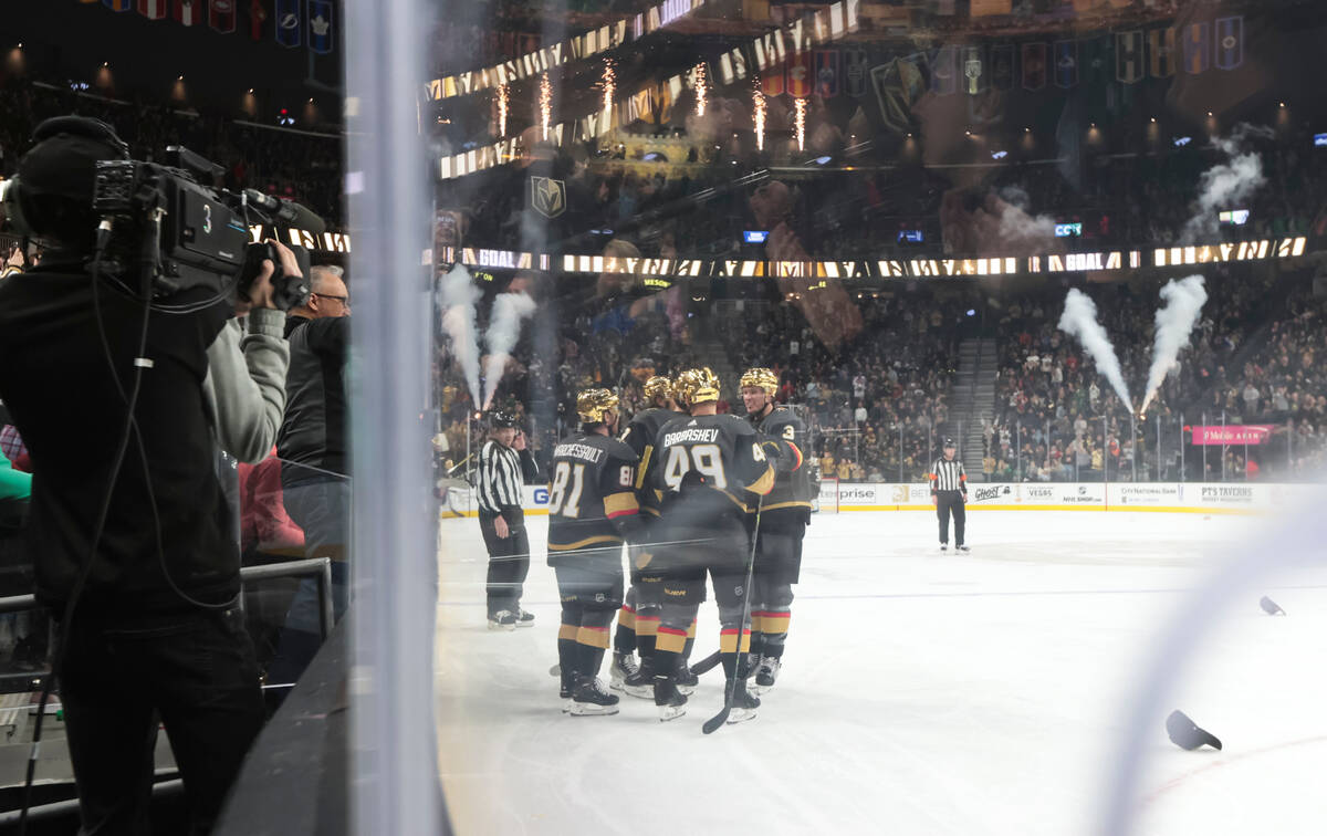 The Golden Knights celebrate a hat trick by center Jack Eichel (9) during the third period of a ...
