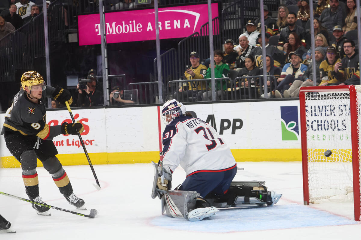 Golden Knights center Jack Eichel (9) shoots the puck past Columbus Blue Jackets goaltender Mic ...