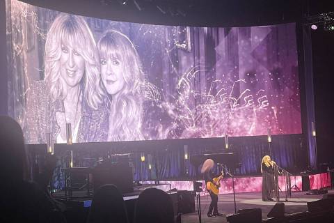 Stevie Nicks and the late Christine McVie of Fleetwood Mac are shown on the big screen at T-Mob ...