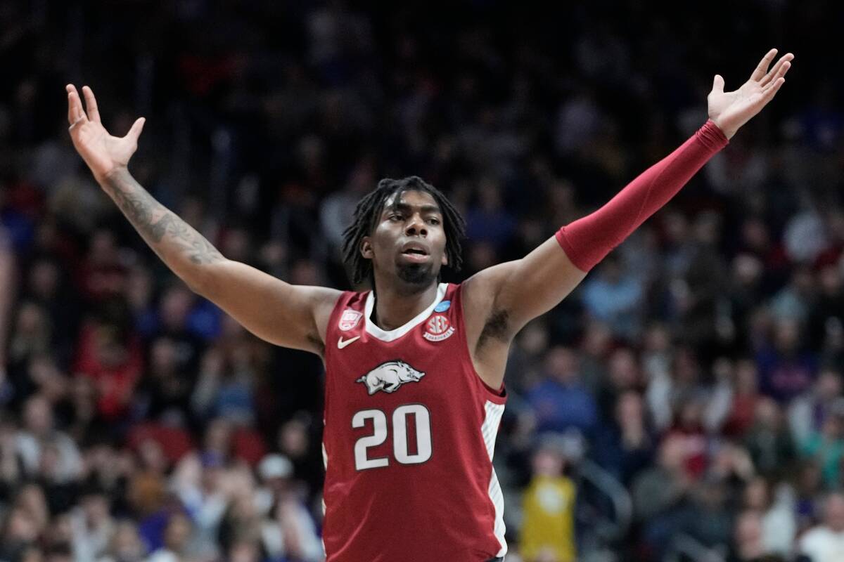 Arkansas' Kamani Johnson reacts after second half of a second-round college basketball game aga ...