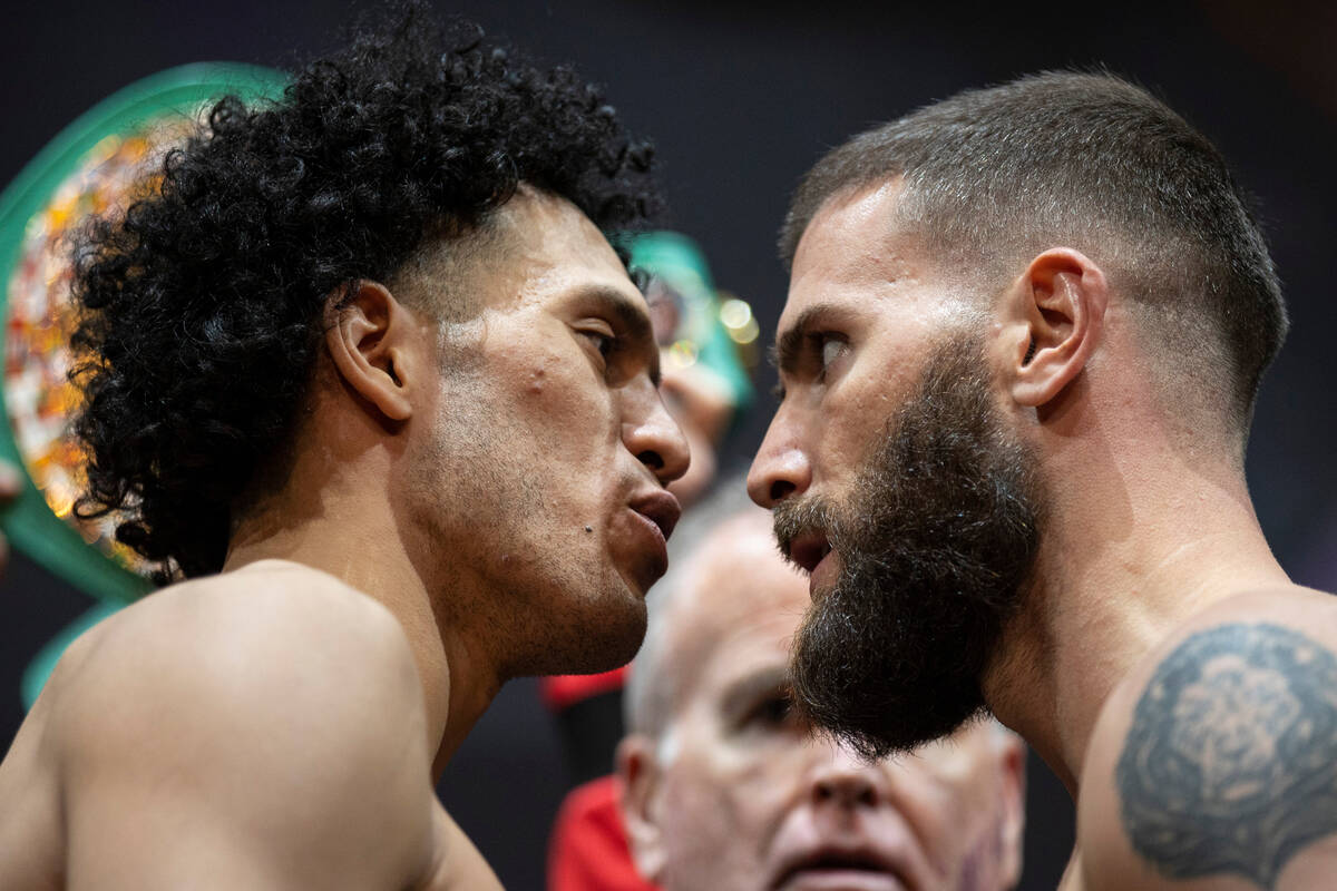 David Benavidez, left, and Caleb Plant, face off during a weigh-in event in advance of their su ...