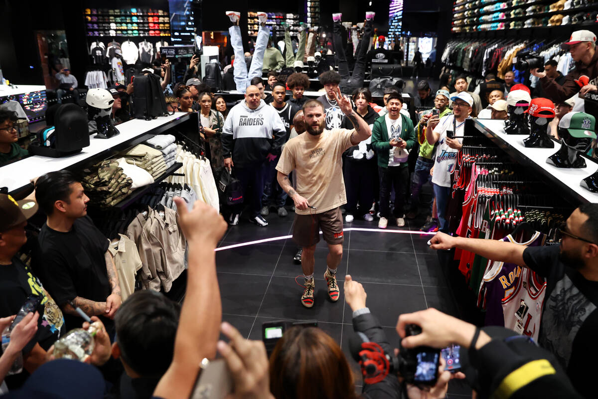 Caleb Plant gestures at the crowd during a media workout at Culture Kings at The Forum Shops in ...