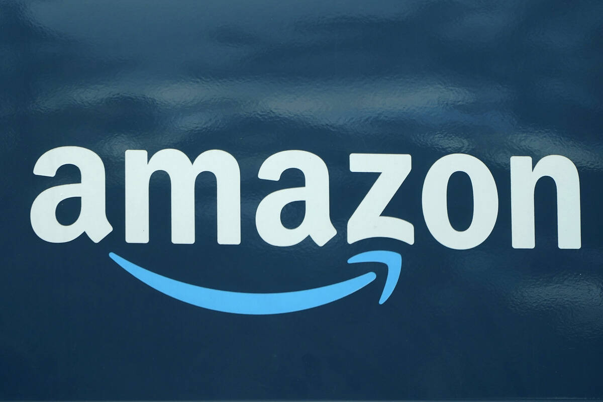 FILE - An Amazon logo appears on a delivery van, Oct. 1, 2020, in Boston. Amazon is pausing con ...