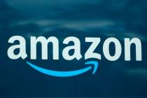 FILE - An Amazon logo appears on a delivery van, Oct. 1, 2020, in Boston. Amazon is pausing con ...