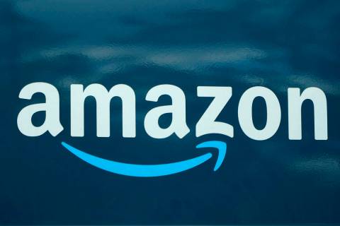 FILE - An Amazon logo appears on a delivery van, Oct. 1, 2020, in Boston. Amazon is pausing con ...