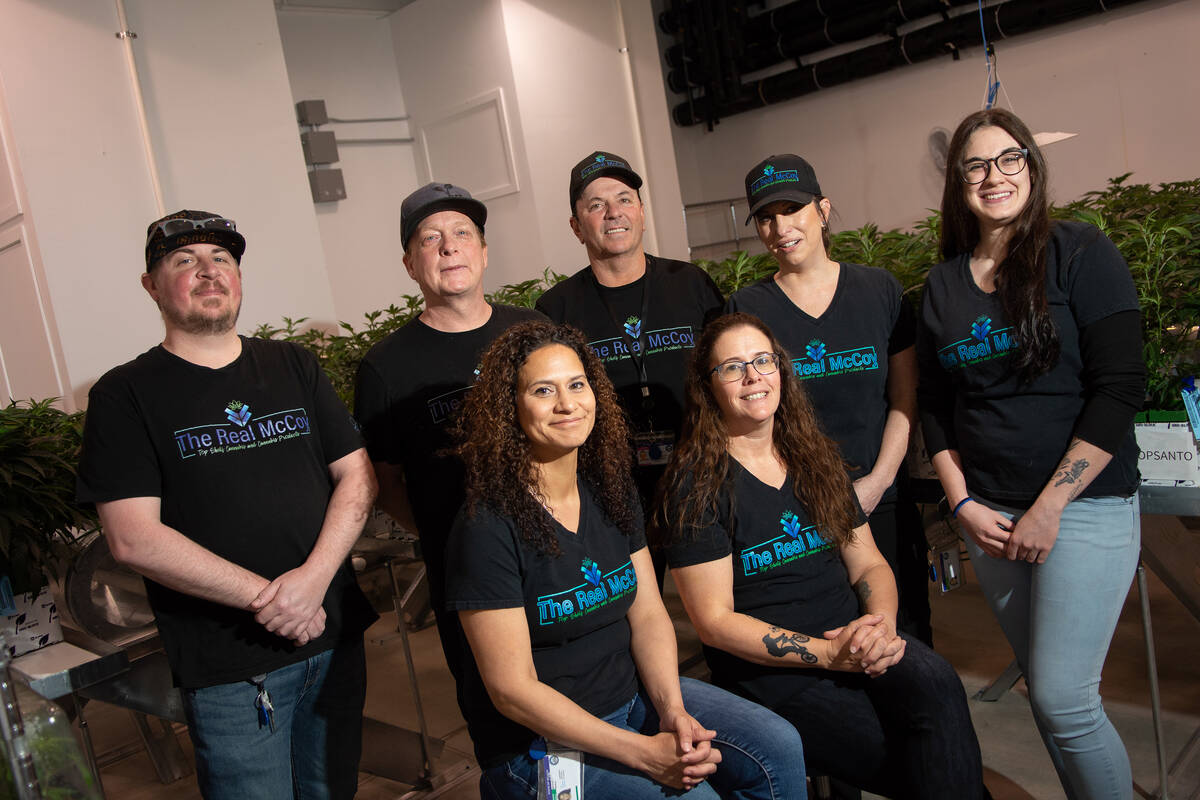 The Real McCoy owners and employees pose for a portrait inside their cultivation and production ...