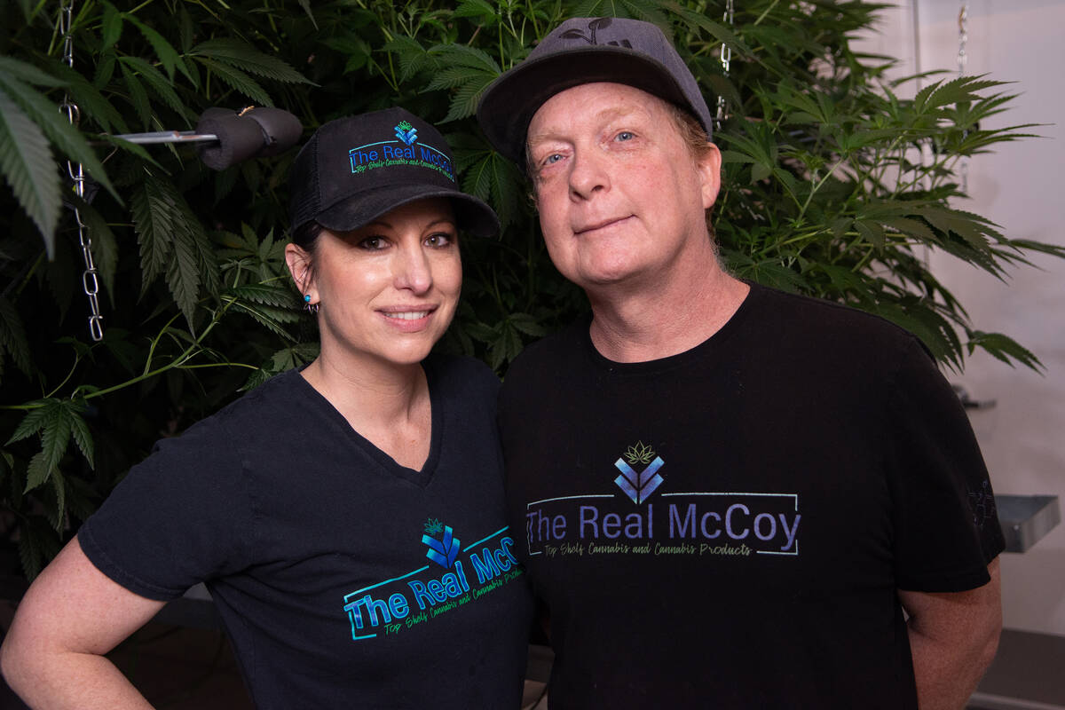 The Real McCoy co-owners, husband and wife Carissa and Chad McCoy, pose for a photo inside the ...