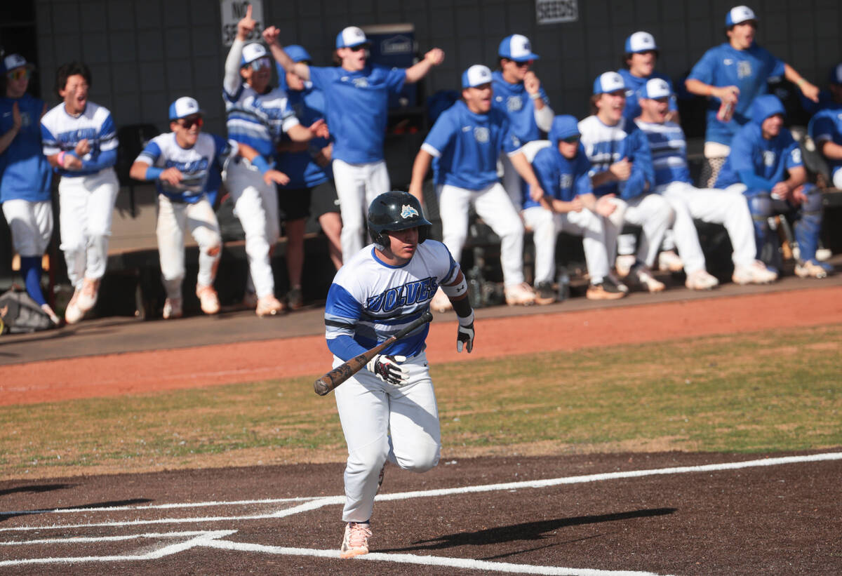 Basic's Robin Vergara (1) tosses his bat while running to first base during a baseball game aga ...