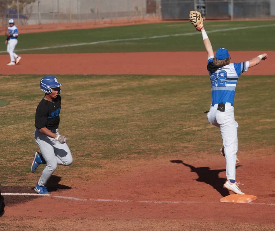 Green Valley's infielder Caden Kirby (12) gets tagged out by Basic’s Cooper Sheff (22) d ...