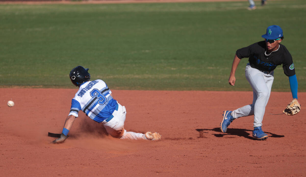 Basic's Ty Southisene (3) slides into second base against Green Valley's Caden Kirby (12) durin ...