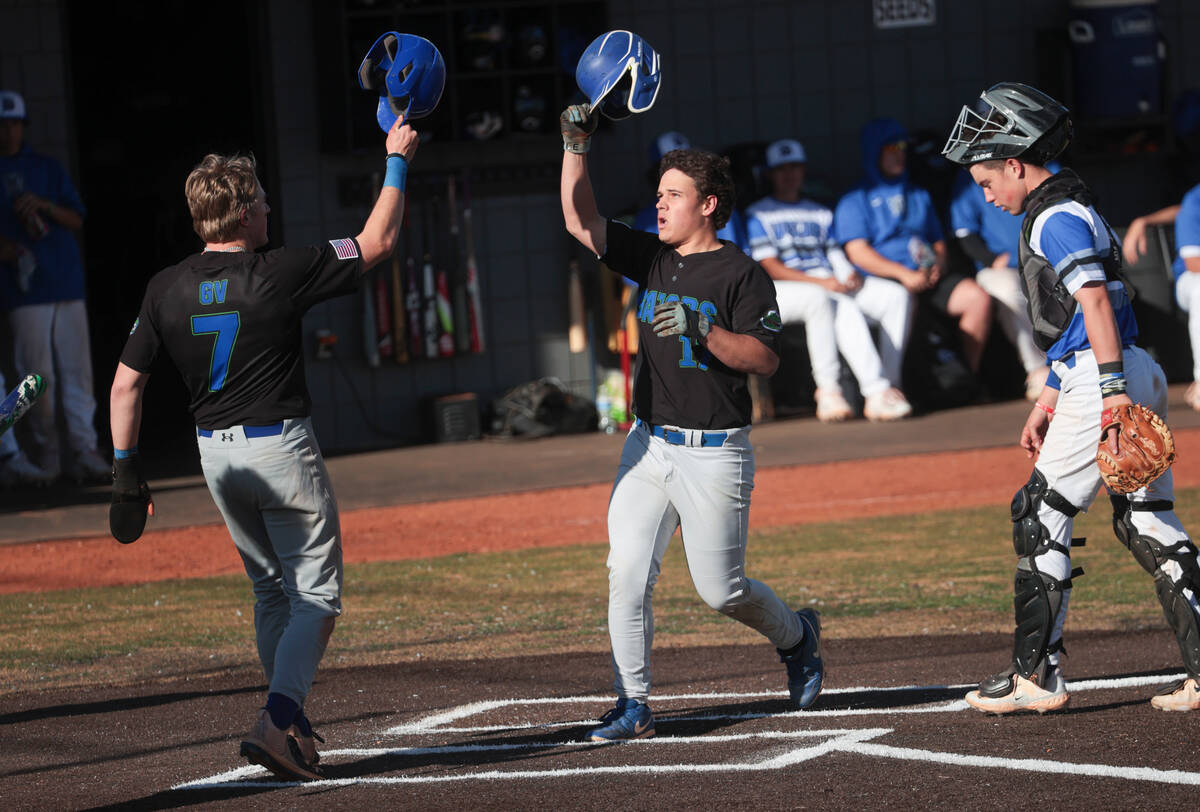 Green Valley's Connor Apeceche (17) celebrates his home run with Green Valley's Brady Ballinger ...