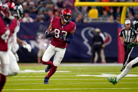 Houston Texans tight end O.J. Howard (83) carries on a pass reception in the first half of an N ...