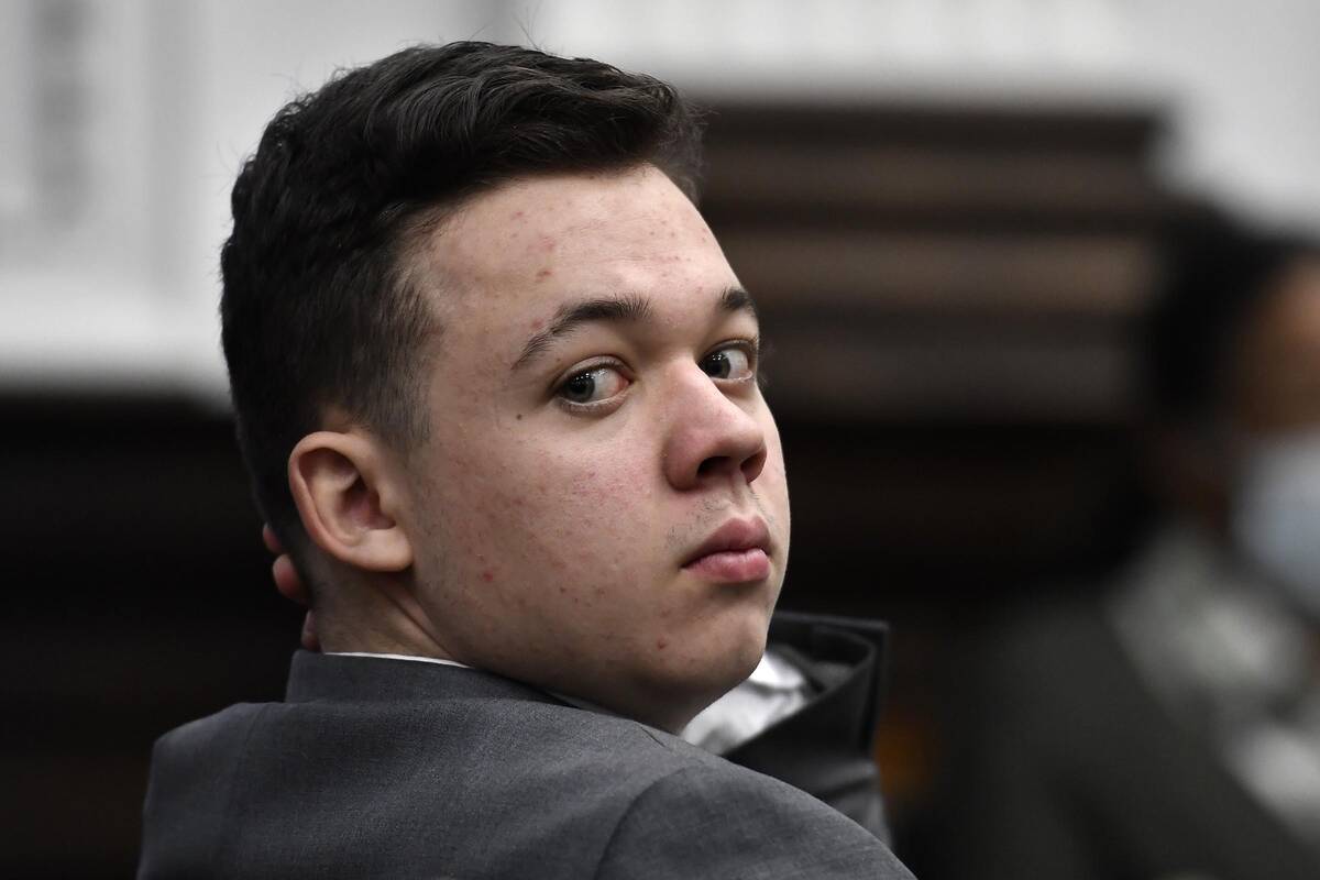 FILE - Kyle Rittenhouse looks back as attorneys argue about the charges that will be presented ...
