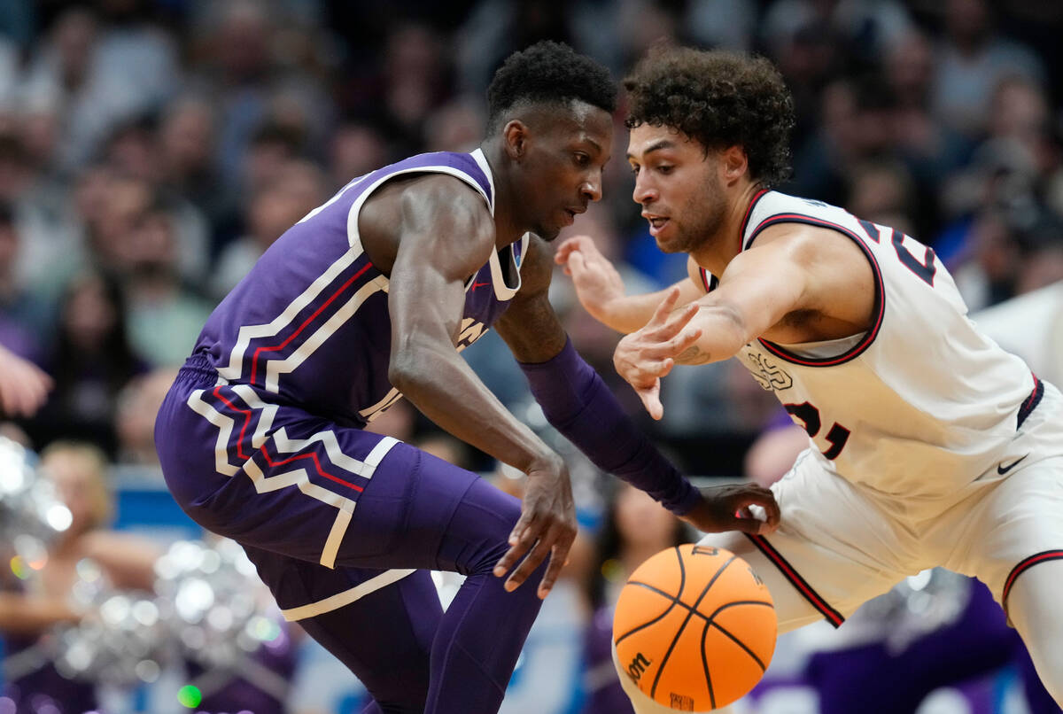 TCU guard Damion Baugh (10) and Gonzaga forward Anton Watson (22) in the second half of a secon ...